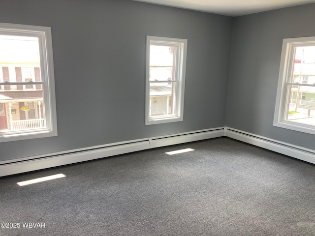 215 E 8th St, Watsontown, PA 17777 - carpeted spare room featuring baseboard heating
