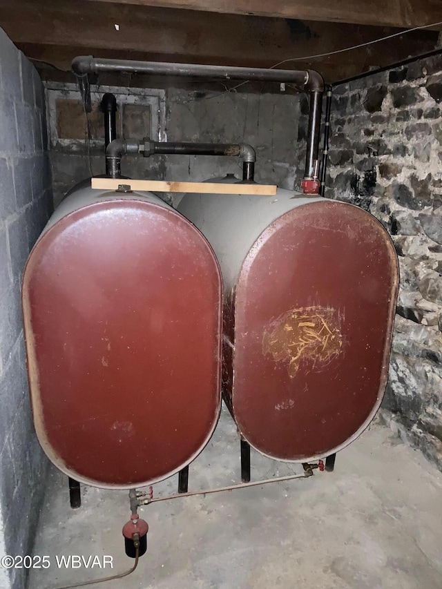 215 E 8th St, Watsontown, PA 17777 - basement view of oil tank and unfinished concrete flooring