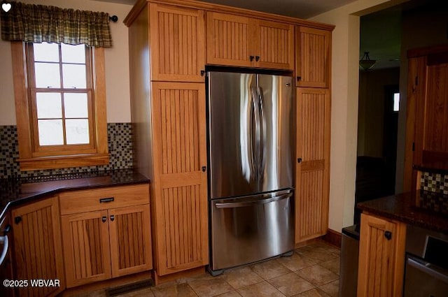 796 Ellis Artley Rd, Muncy, PA 17756 - kitchen featuring freestanding refrigerator, decorative backsplash, and light tile patterned flooring