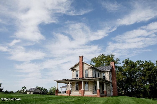 796 Ellis Artley Rd, Muncy, PA 17756 - rear view of property featuring a chimney, a porch, a standing seam roof, a lawn, and metal roof