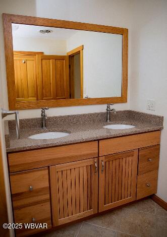 796 Ellis Artley Rd, Muncy, PA 17756 - bathroom featuring double vanity and tile patterned flooring