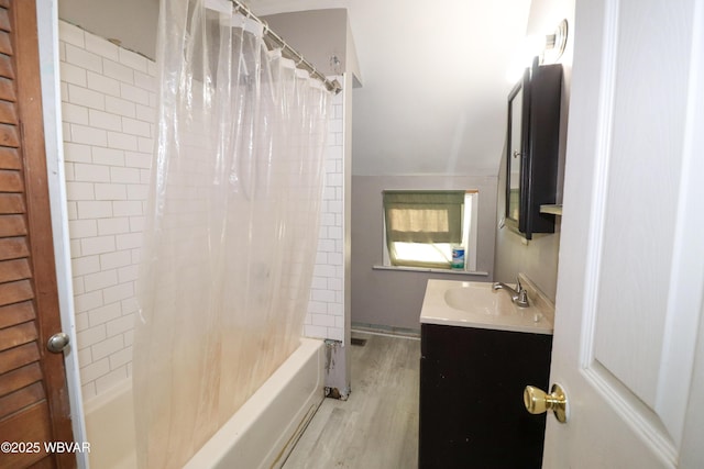 bathroom with shower / bath combo with shower curtain, vanity, vaulted ceiling, and hardwood / wood-style flooring