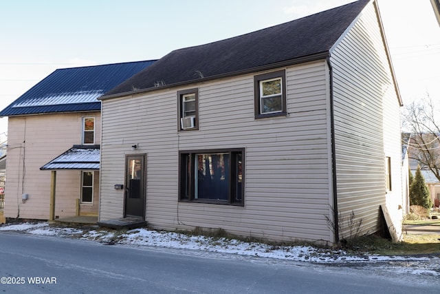 view of front facade featuring cooling unit