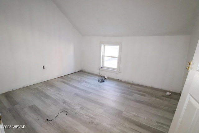 bonus room with light hardwood / wood-style flooring