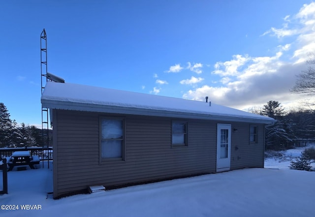 view of snow covered house