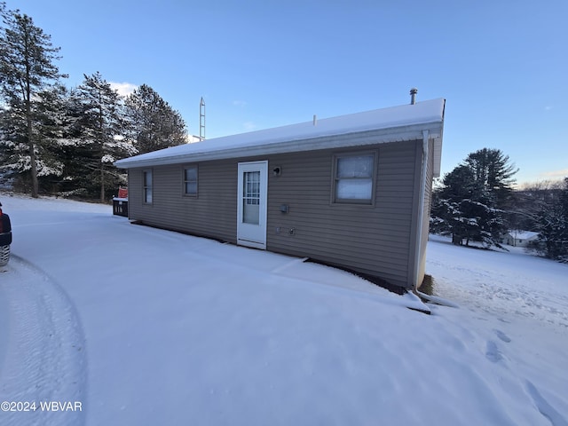 view of snow covered house