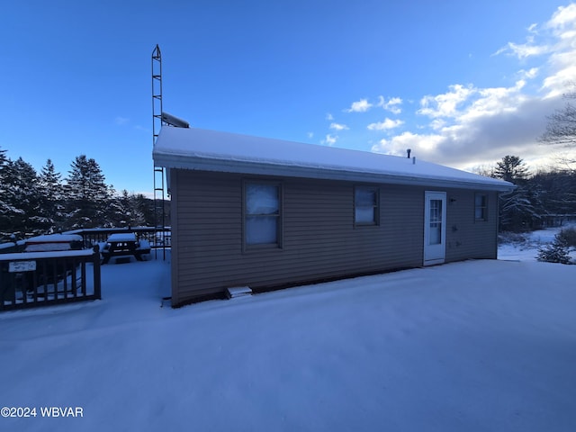 view of snow covered house