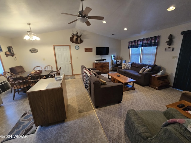 living room featuring ceiling fan with notable chandelier and vaulted ceiling