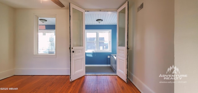 doorway with hardwood / wood-style floors