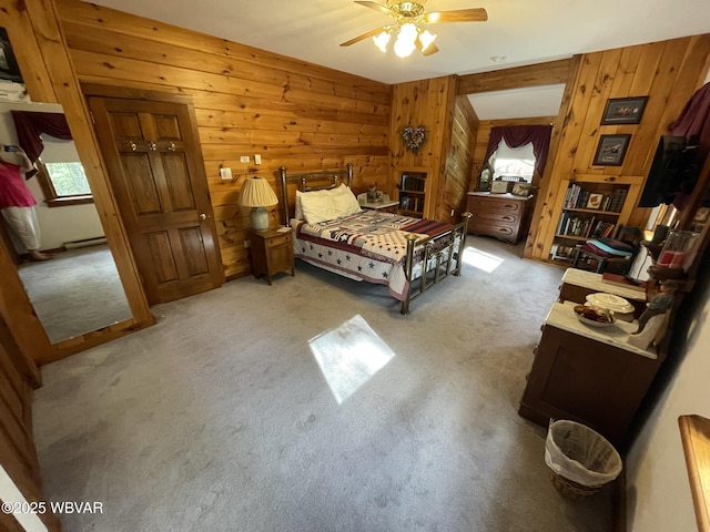 bedroom with carpet floors and wood walls
