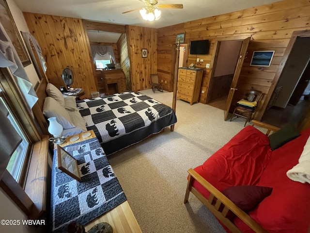 bedroom featuring carpet floors and wooden walls