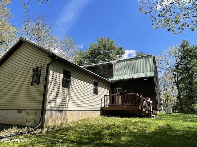 back of house featuring central air condition unit, a wooden deck, a yard, and crawl space