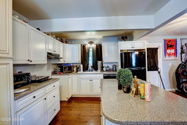 339 Spruce St, Jersey Shore, PA 17740 - kitchen with freestanding refrigerator, stainless steel microwave, under cabinet range hood, a kitchen island, and a sink