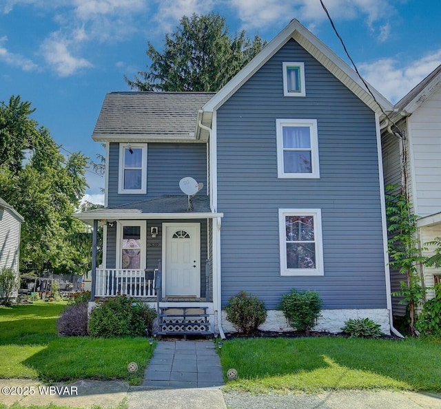 339 Spruce St, Jersey Shore, PA 17740 - traditional-style house featuring covered porch, a front yard, and roof with shingles