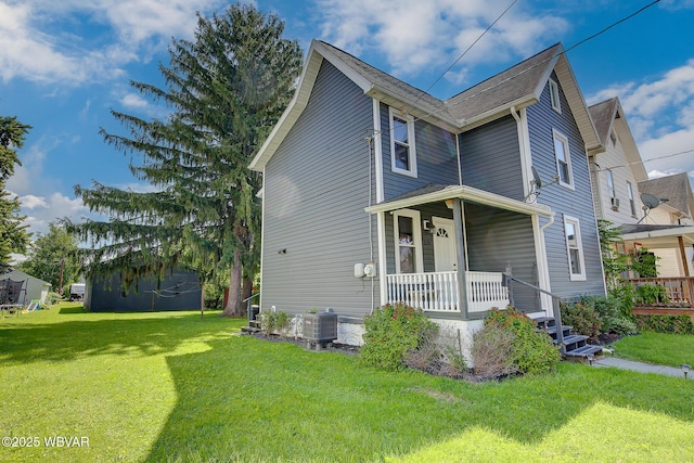 339 Spruce St, Jersey Shore, PA 17740 - view of front of home featuring covered porch, a front yard, and central air condition unit