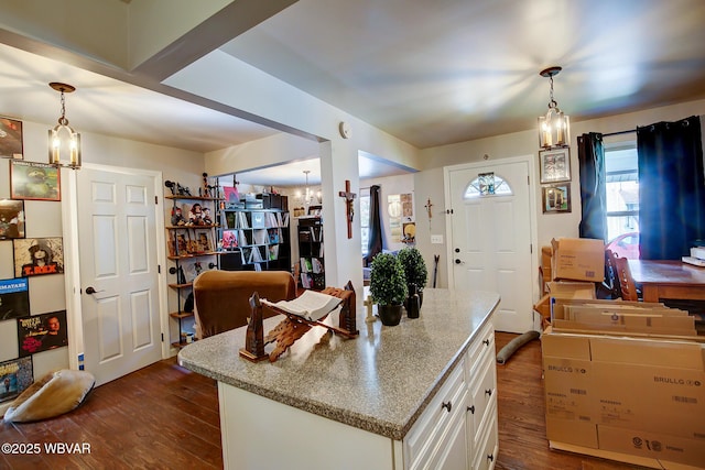 339 Spruce St, Jersey Shore, PA 17740 - kitchen featuring a chandelier, dark wood-style floors, white cabinets, and decorative light fixtures