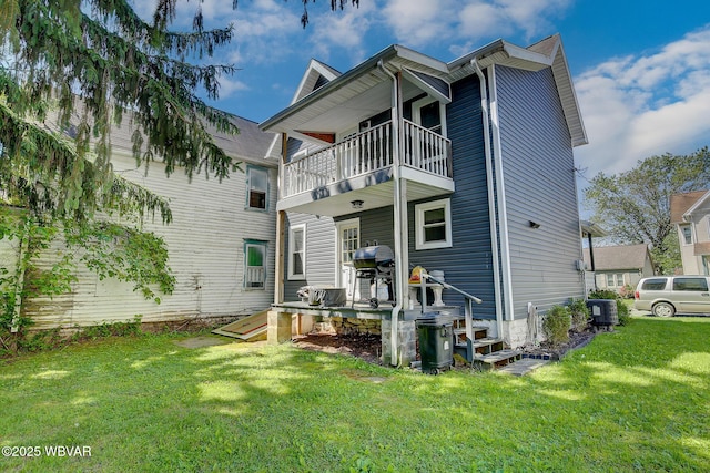 339 Spruce St, Jersey Shore, PA 17740 - back of property with a balcony and a lawn