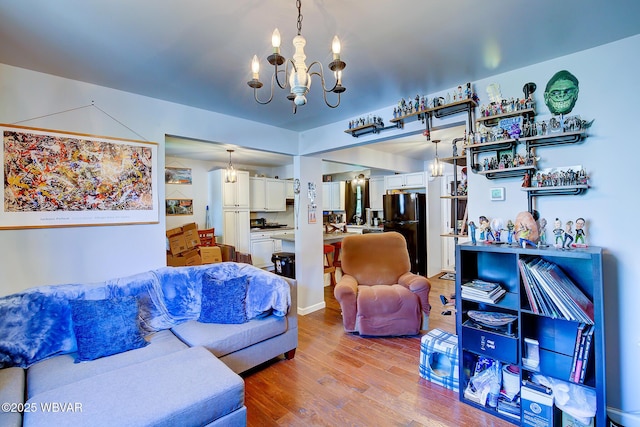 339 Spruce St, Jersey Shore, PA 17740 - living room featuring a chandelier and wood finished floors