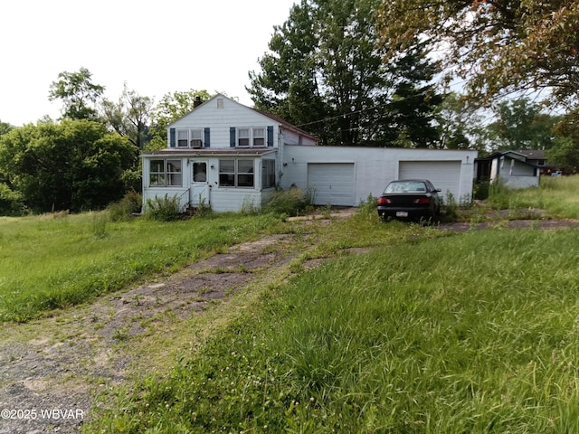 71 Hillcrest Dr, Towanda, PA 18848 - back of house featuring driveway and an attached garage