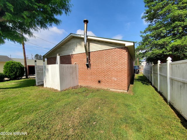 back of property featuring a yard