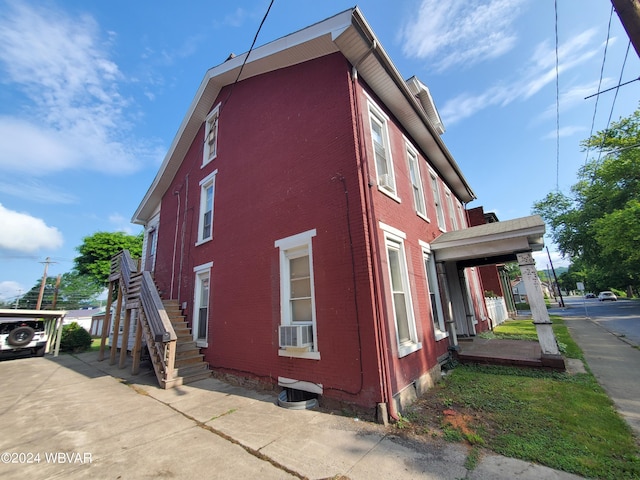 view of side of property featuring cooling unit