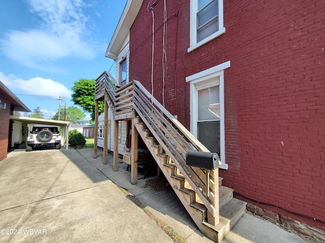 view of side of property featuring a carport