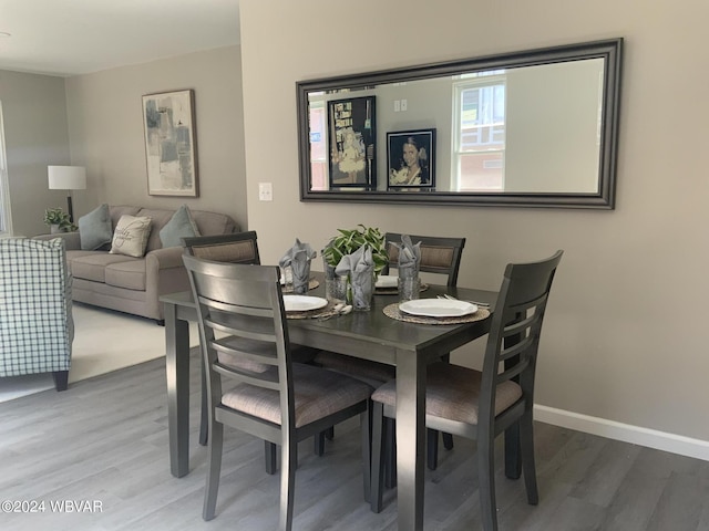 dining area with hardwood / wood-style floors