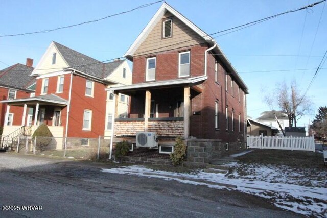 view of side of property with a lawn