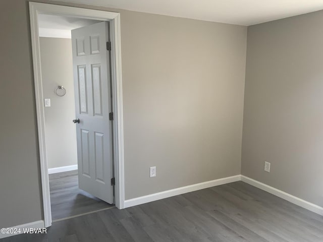 spare room featuring dark hardwood / wood-style floors