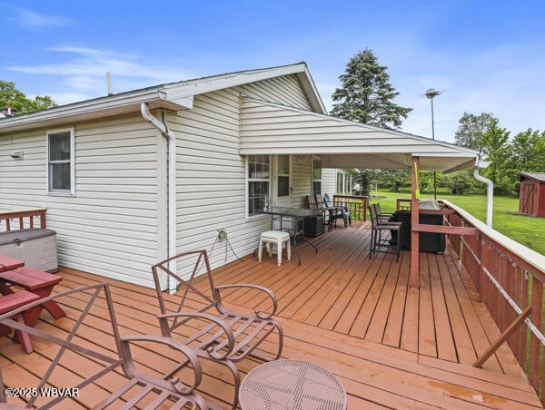 1498 Gainer Hill Rd, Dushore, PA 18614 - wooden terrace featuring outdoor dining area and a yard