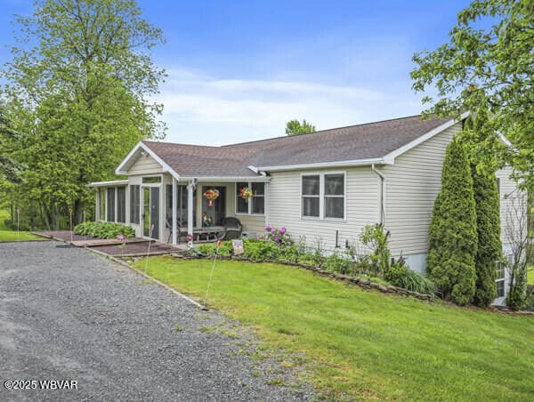 1498 Gainer Hill Rd, Dushore, PA 18614 - ranch-style house featuring a sunroom and a front lawn