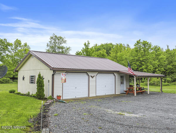 1498 Gainer Hill Rd, Dushore, PA 18614 - garage featuring gravel driveway