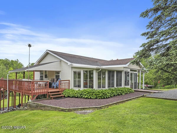1498 Gainer Hill Rd, Dushore, PA 18614 - back of house with a yard, a sunroom, and a deck