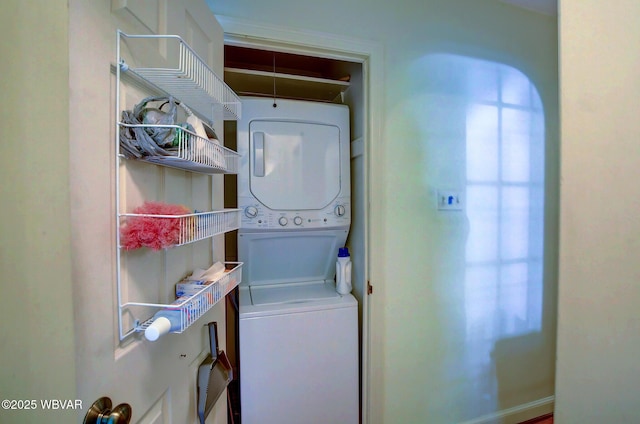 washroom featuring laundry area and stacked washer and clothes dryer