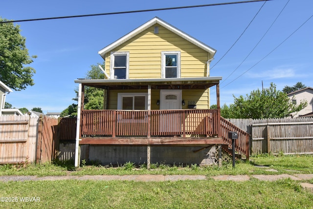 exterior space with a lawn and a wooden deck