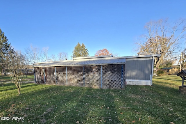 view of outdoor structure with a yard