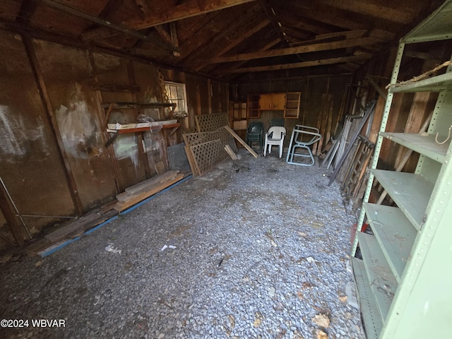 miscellaneous room with lofted ceiling