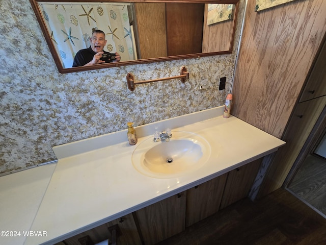 bathroom with vanity and hardwood / wood-style flooring