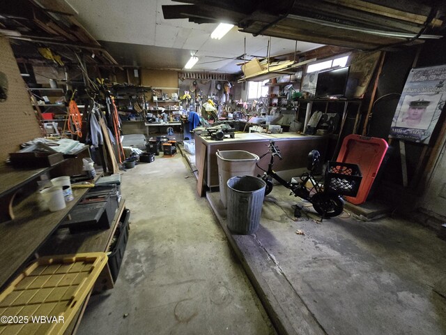 interior space with a workshop area and concrete floors