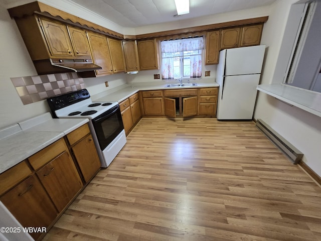 kitchen featuring range with electric cooktop, sink, white refrigerator, baseboard heating, and light hardwood / wood-style floors