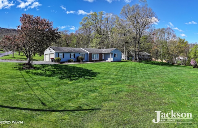 143 Hillside Dr S, Williamsport, PA 17702 - single story home featuring a garage, driveway, and a front yard