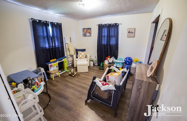 143 Hillside Dr S, Williamsport, PA 17702 - playroom featuring a textured ceiling and wood finished floors