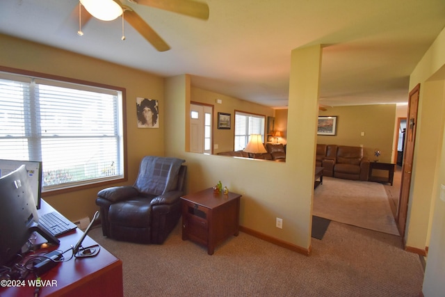 home office with ceiling fan and light colored carpet