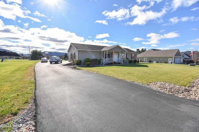 view of front of property featuring a porch and a front lawn