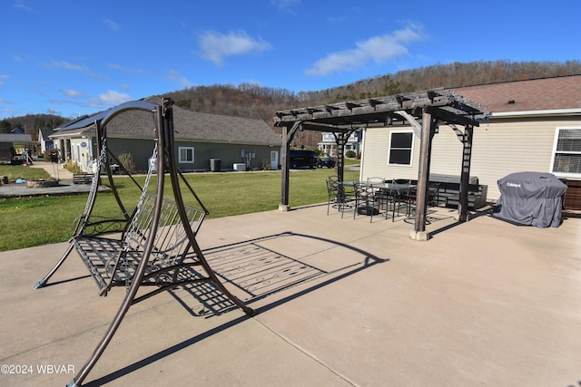 view of patio / terrace featuring a pergola and area for grilling