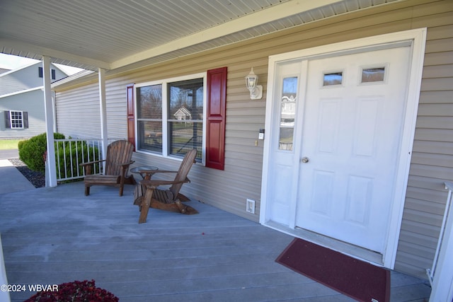 doorway to property with a porch