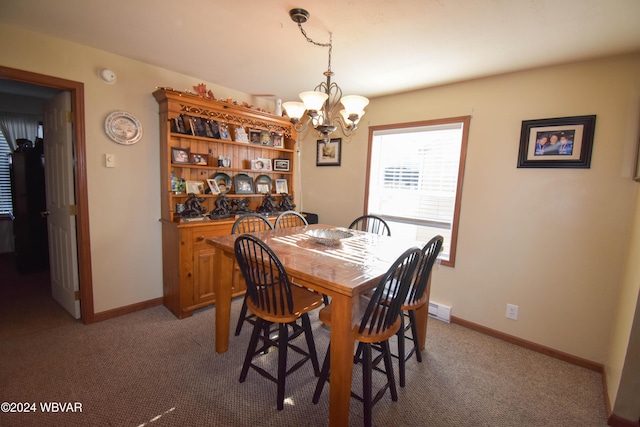 dining space with carpet flooring, a baseboard radiator, and a notable chandelier