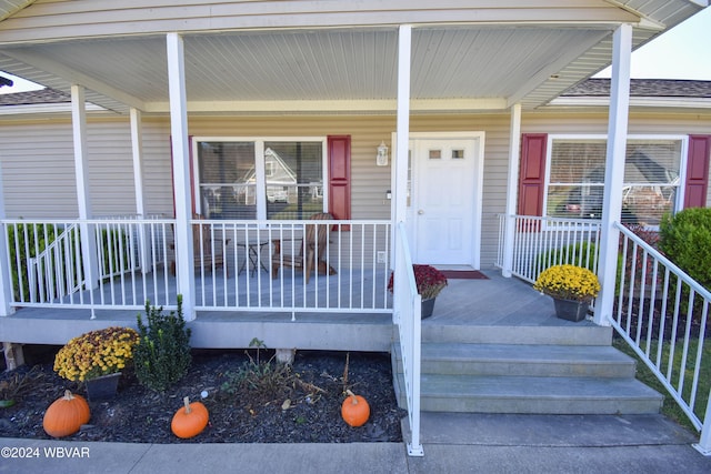 doorway to property with a porch