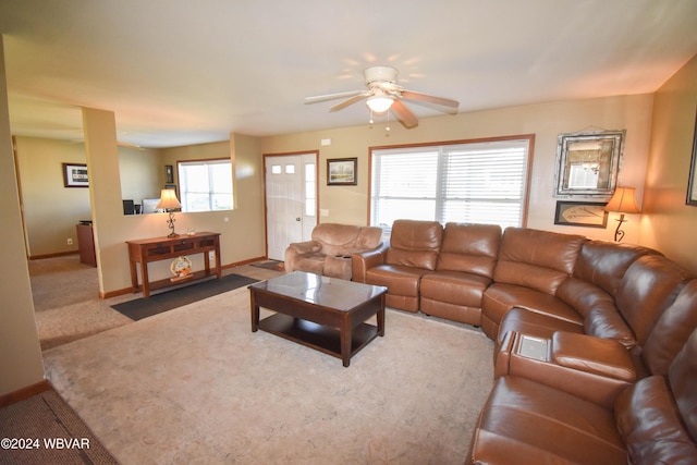 living room with carpet flooring, ceiling fan, and plenty of natural light