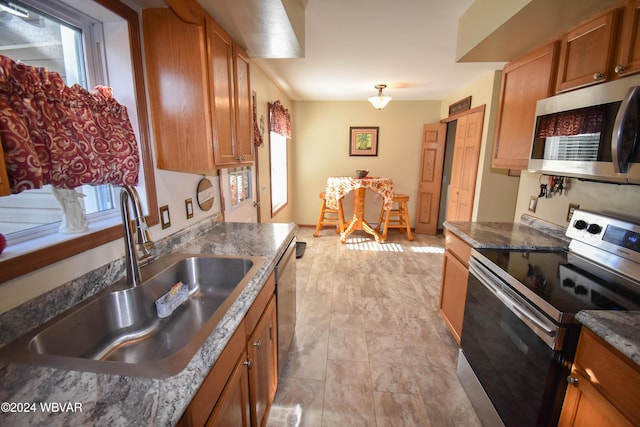 kitchen featuring stainless steel appliances and sink